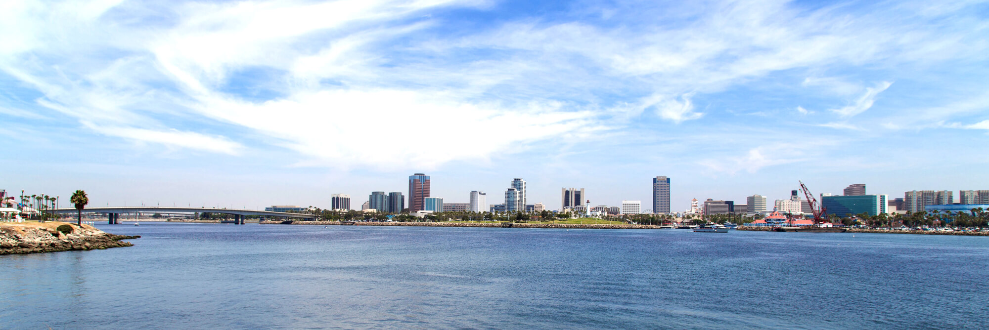 A wide panoramic view of Long Beach and a bridge