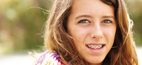 A young girl with braces