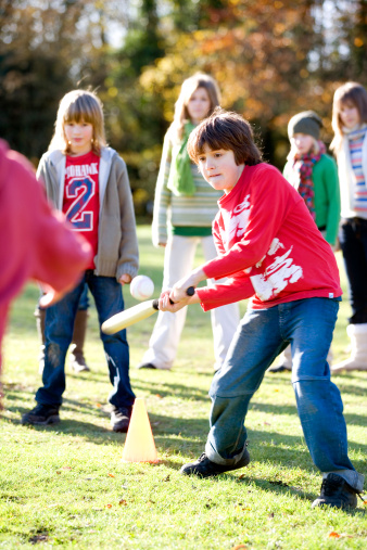 Children playing a baseball type game