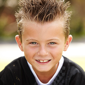 A young boy smiling