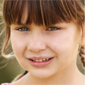 A young girl smiling